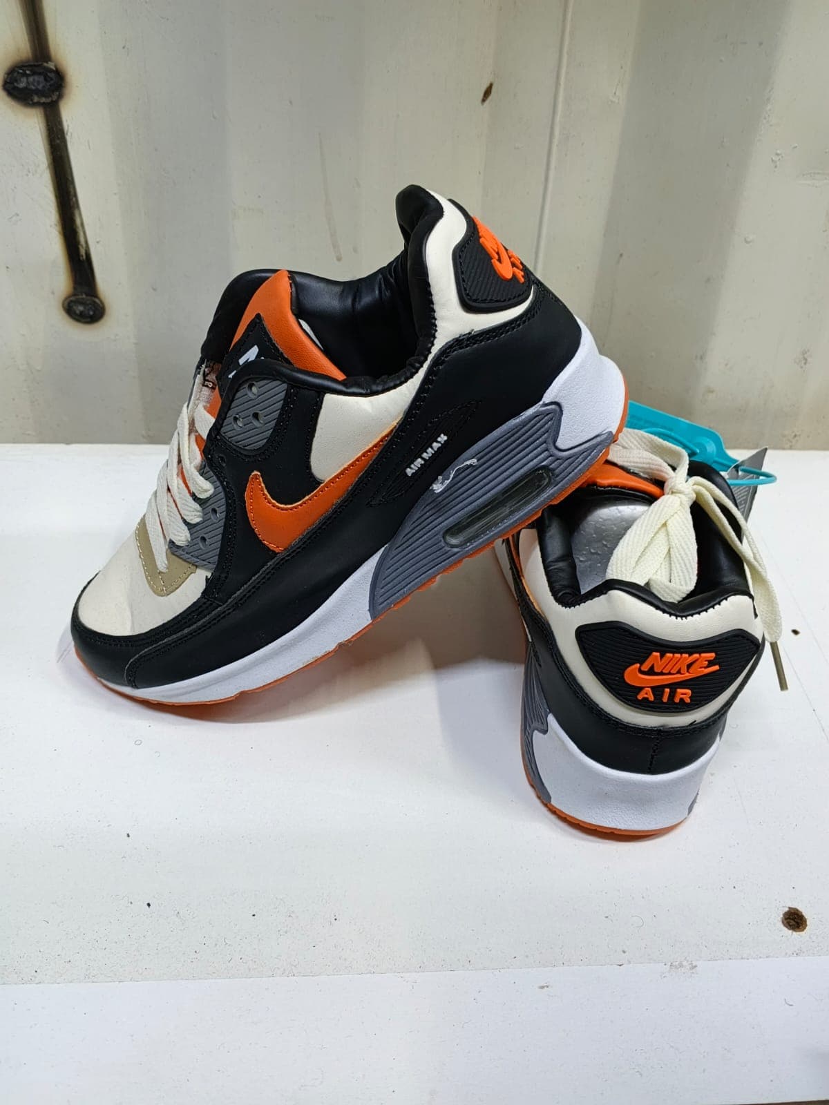 Black & Orange Jordan 4s 2