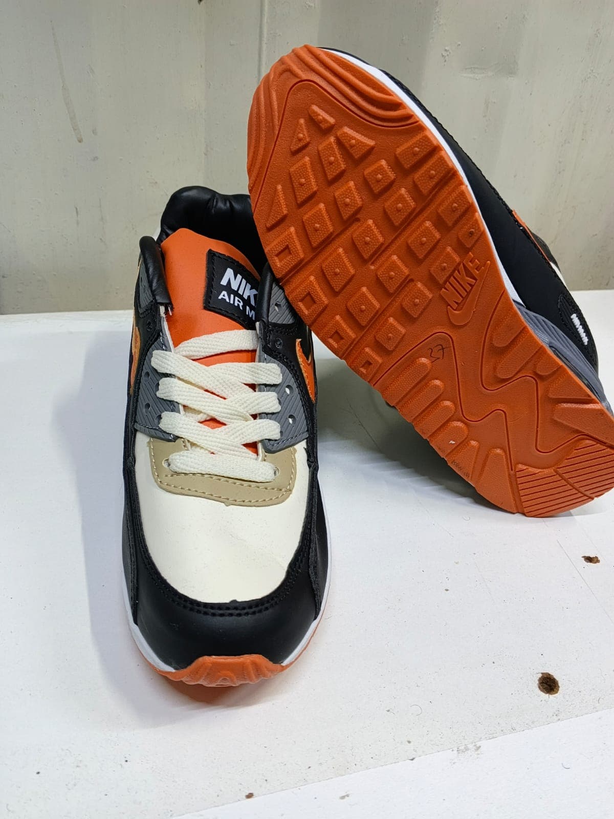 Black & Orange Jordan 4s 7